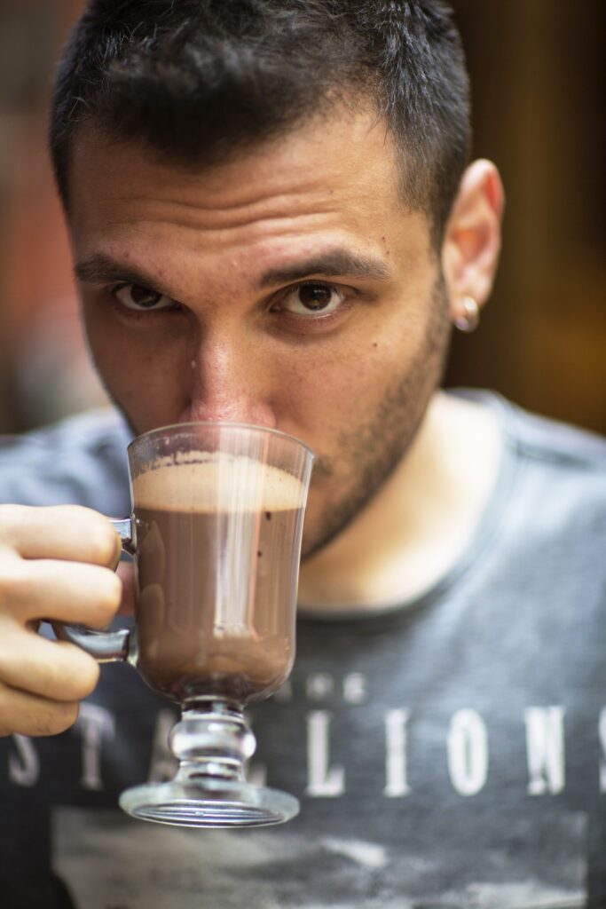 man drinking coffee creamer